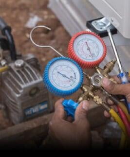 Person working on refrigeration unit