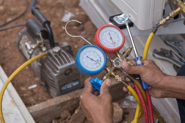 Person working on refrigeration unit